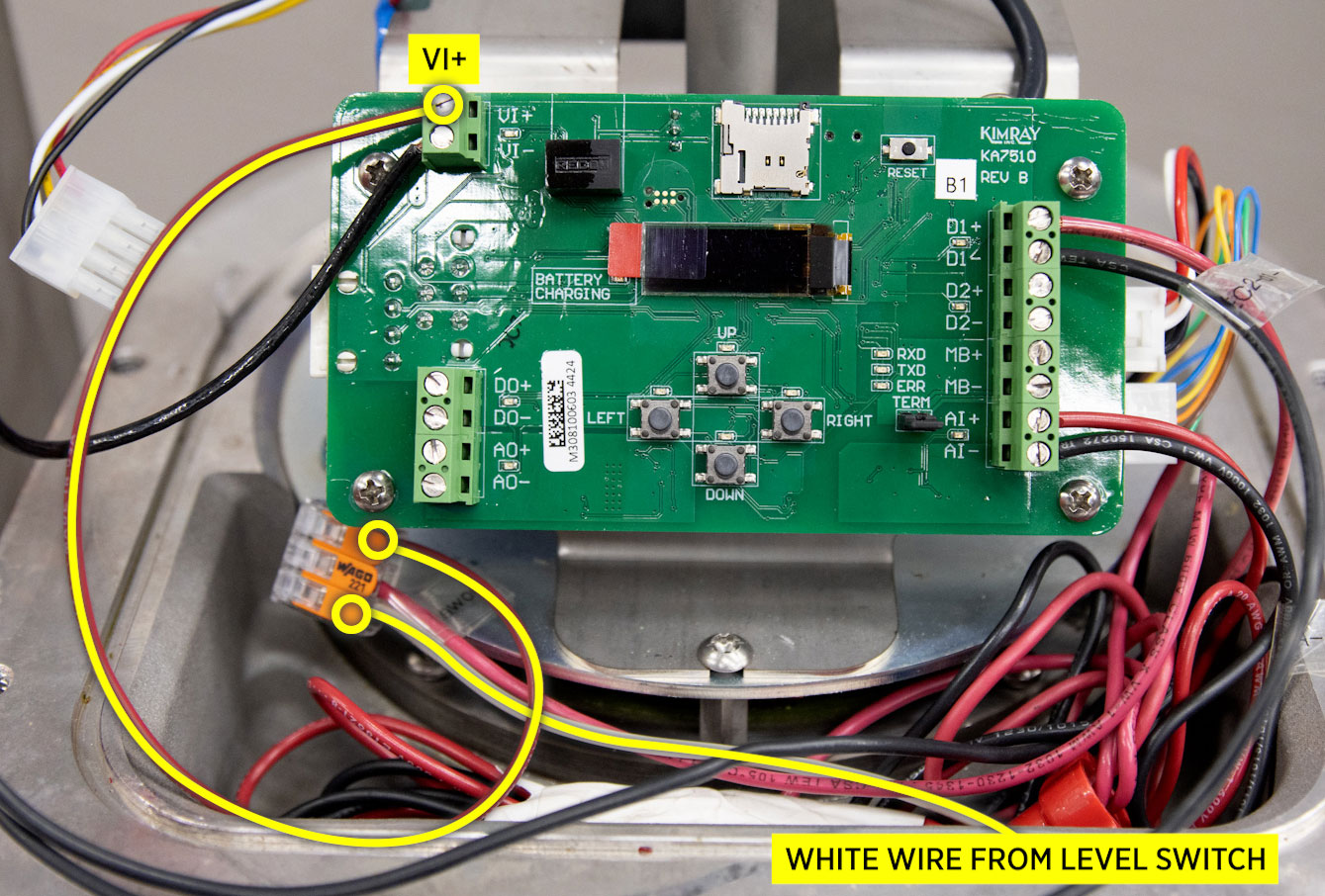 Next, take the white “common” wire and connect it to VI+.