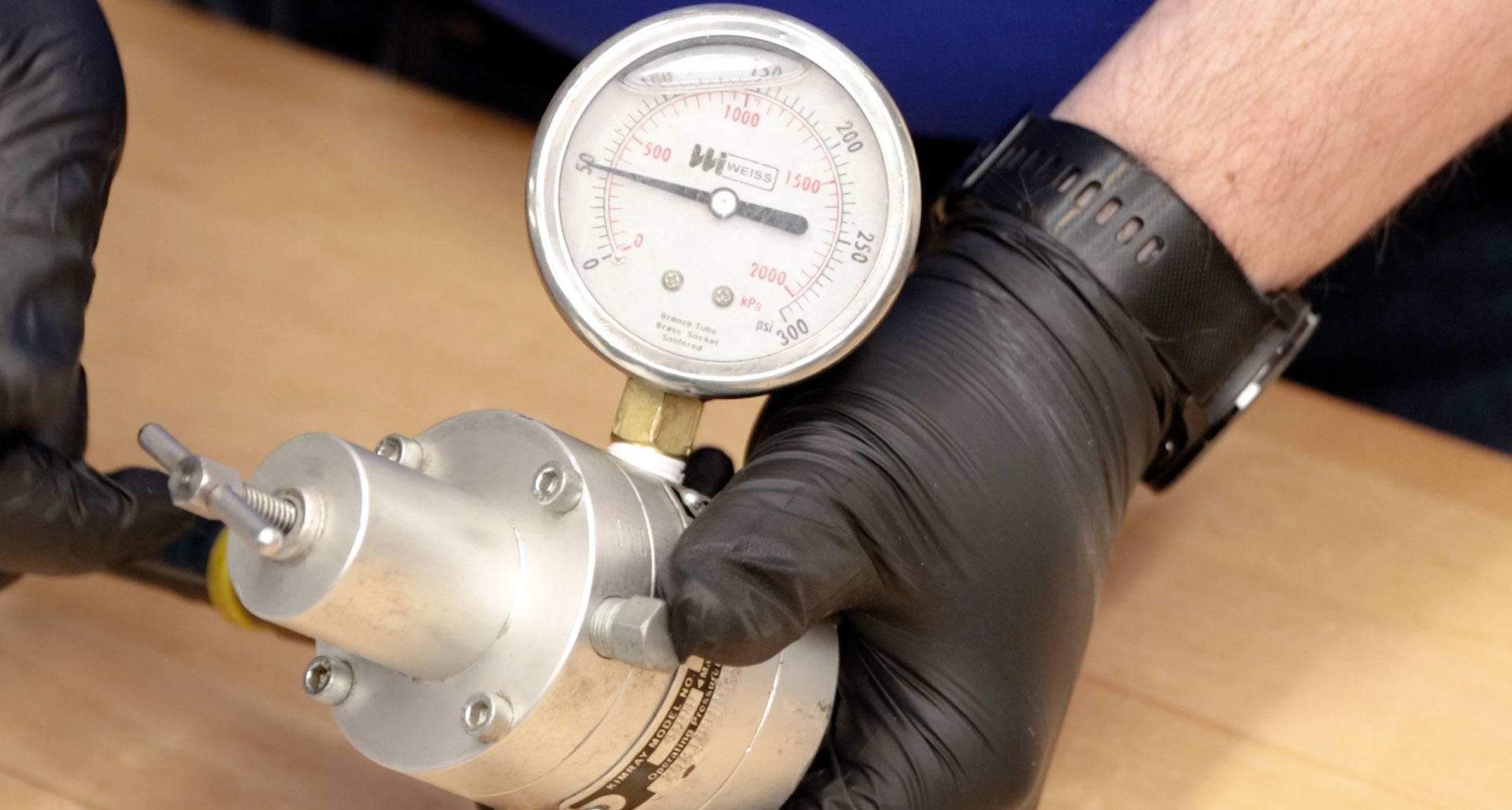 regulated air supply to 50 psi using a regulator and pressure gauge
