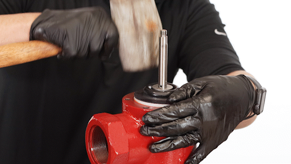 inserting the cage assembly with a rubber mallet